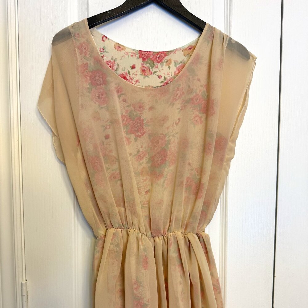 Beige Sleeveless Dress with Floral Designs